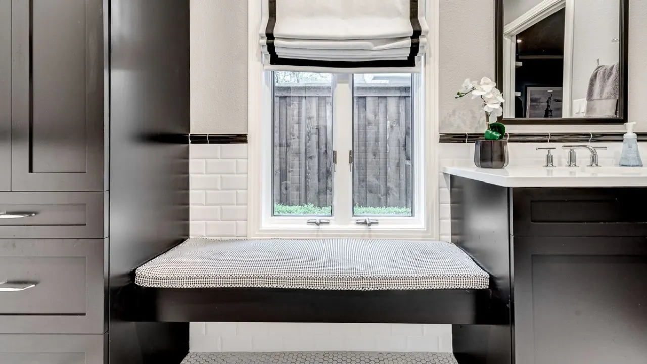 Arlington bathroom remodel idea: guest bathroom with black cabinets, a window bench and subway tile