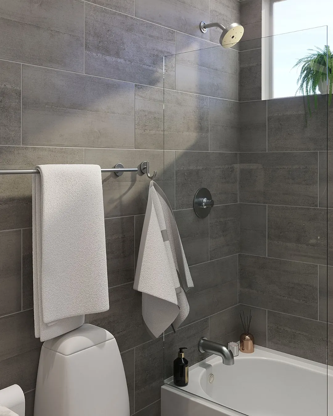 Tub and shower combo with large gray plank tile, a fixed glass panel and a window above the tub