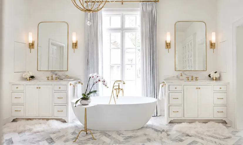 Coppell bathroom remodel idea: master bathroom with a freestanding tub between twin white vanities
