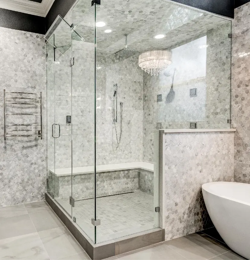 Mansfield bathroom remodel idea: steam shower with full-height glass and a marble bench