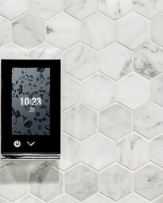 Steam shower control panel set into white marble hexagon tile, by Nomi